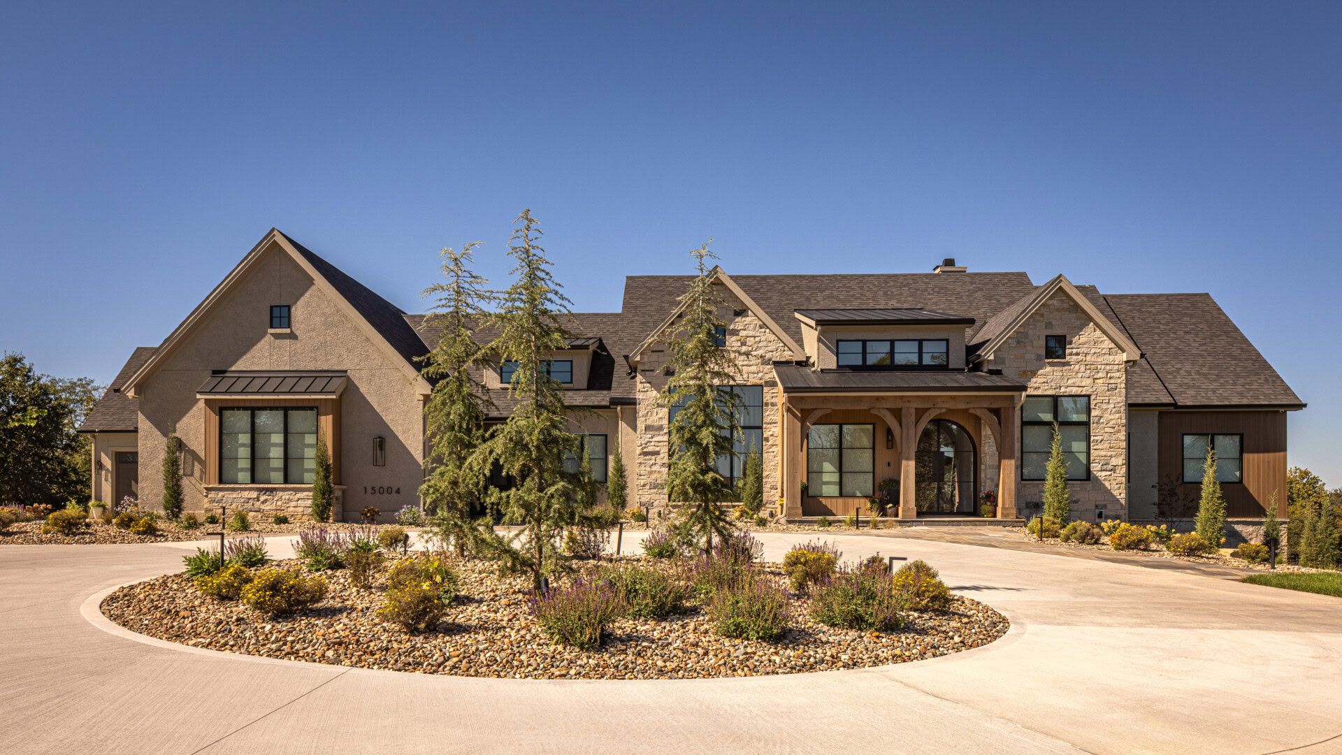 Cardinal Crest Homes Exterior View Cardinal Crest Homes luxury residence exterior with circular drive and stone facade.